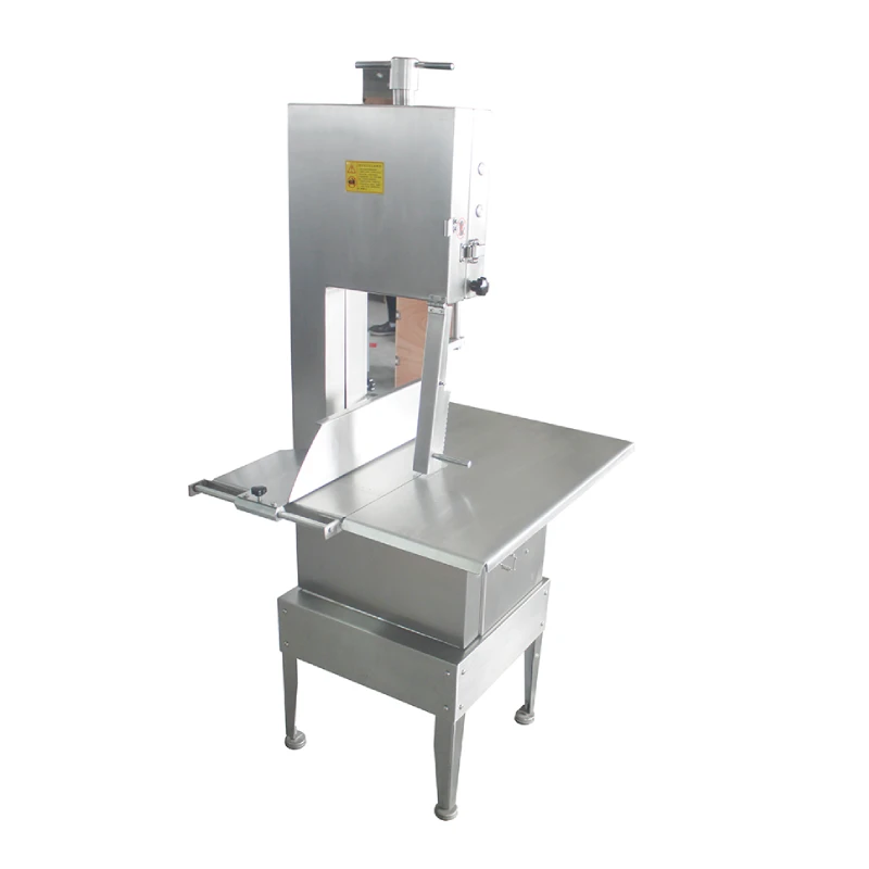 Commercial stainless steel bone cutter (3kW) and meat cutter, equipped with a worktable.
